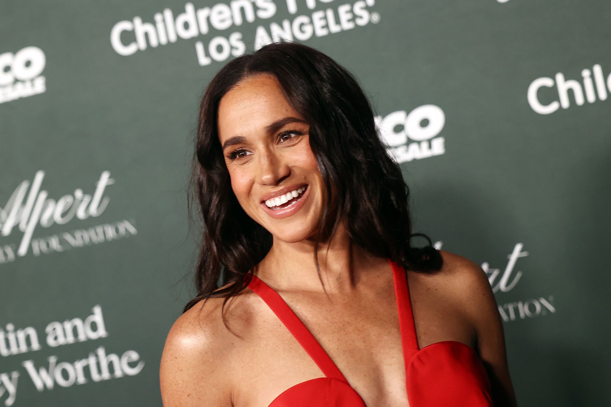 Meghan Markle Dazzles in Red Gown at Charity Gala